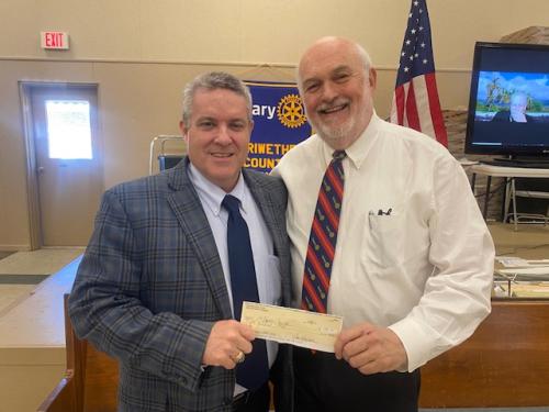 Meriwether Co Rotary Club President Al Griffin presents Bob Patterson a donation for the DORCAS Food Panry ministery.jpg