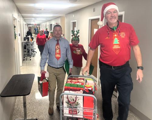 Bart, Cynthia, Dawn and Ben delivering Gifts.jpg
