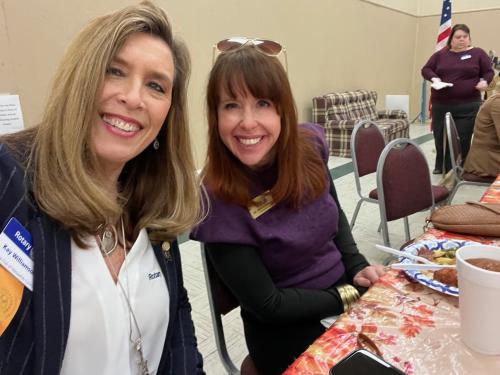 Kay Williamson and Shanna Downs sharing friendsgiving food.jpeg