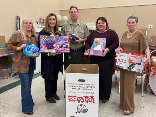 lisa, kay, Jason, Melissa and Jo helping with toys of tots program collection.jpeg