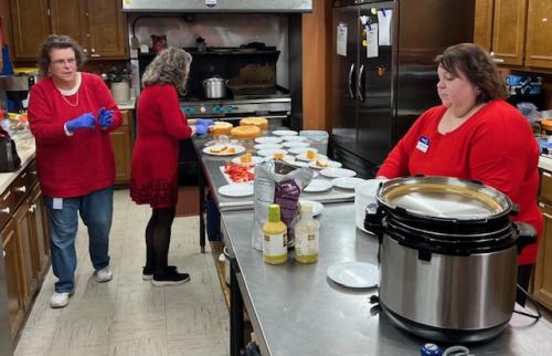 Cynthia, Jo, and Melissa preparing food.jpeg