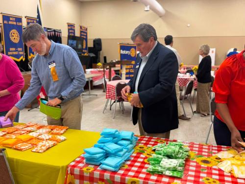 Area Gov Chunck Newman Helping put bags together.jpg